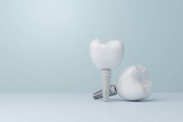 A Randomized Controlled Trial of Guided Bone Regeneration for Peri-Implant Dehiscence Defects with Two Anorganic Bovine Bone Materials Covered by Titanium Meshes